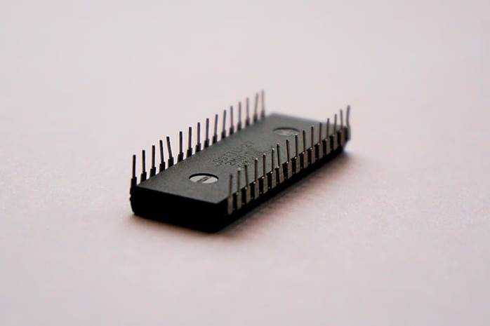 32-pin IC lying on white surface